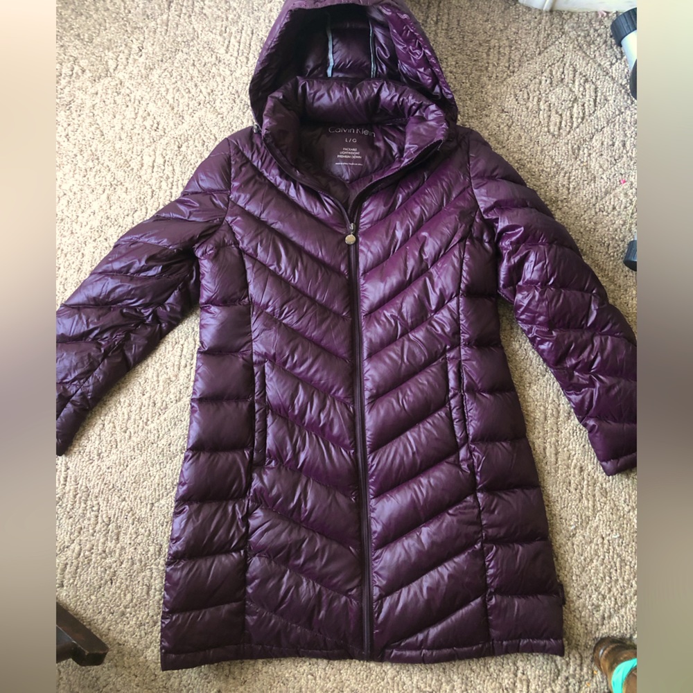 Calvin Klein own jacket Dark wine color even though looks purple in picture